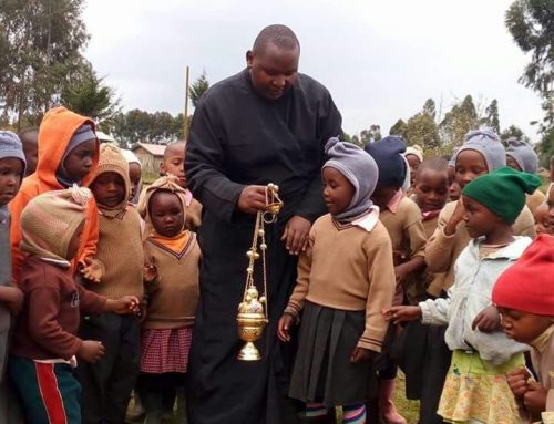 Fr Constantinos with kids demonstrating its use